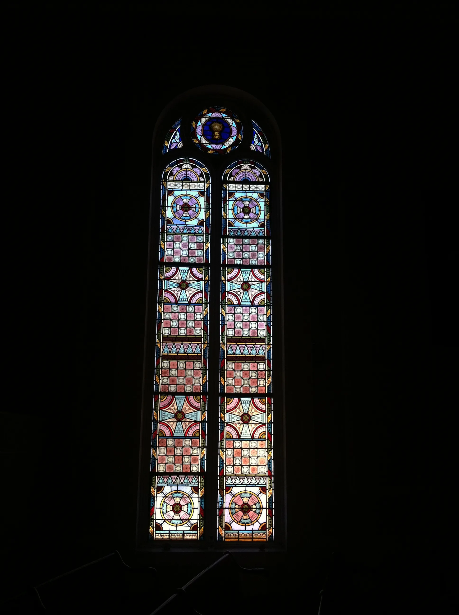 One of the chapter house’s arched stained-glass windows